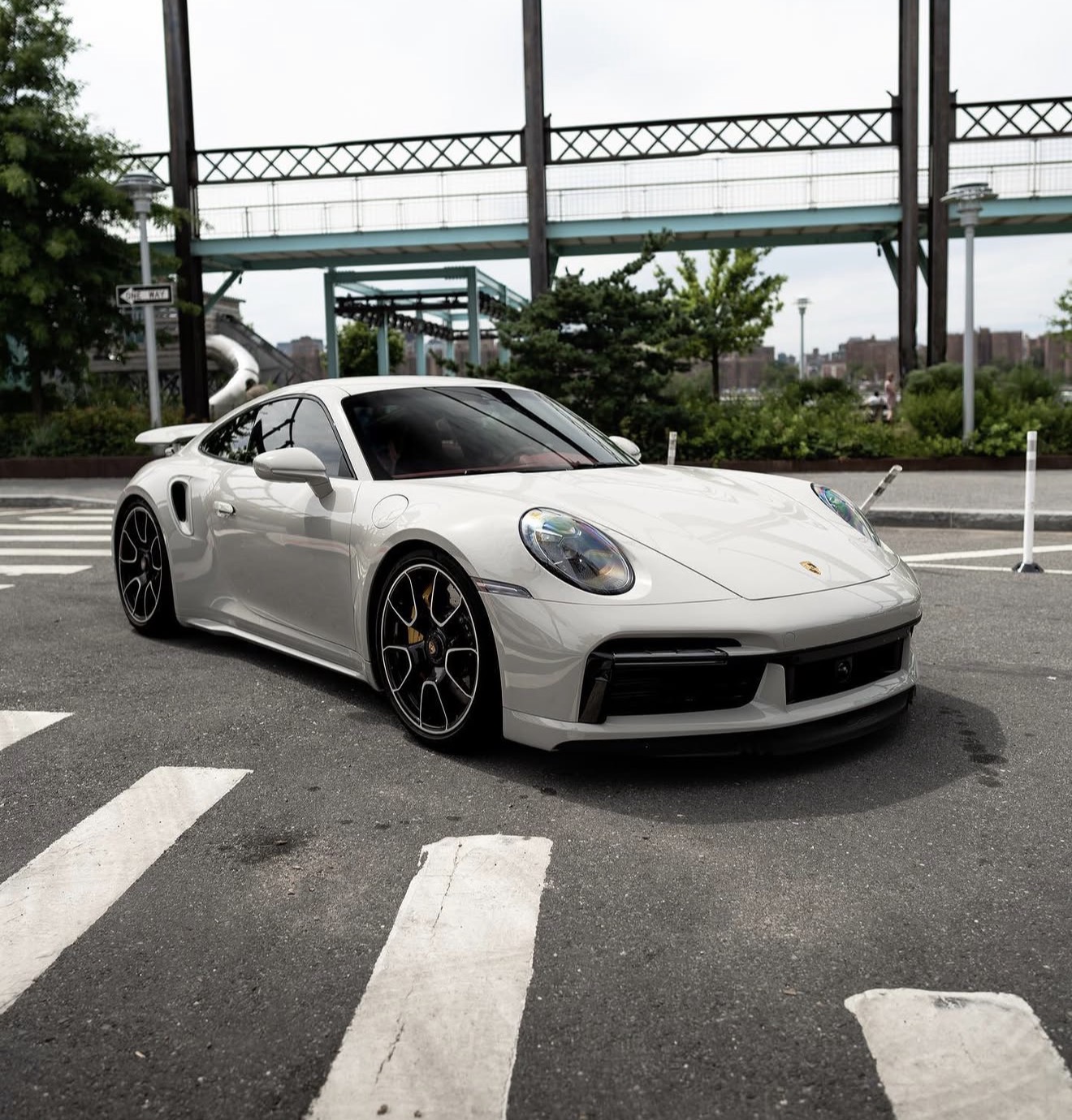 Chalk Porsche 911 Turbo with red leather interior parked outdoors in Brooklyn